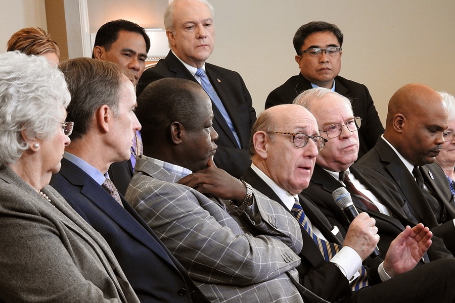 Kenneth Feinberg holding microphone speaks during a livestreamed panel discussion in Tampa Fla.jpg